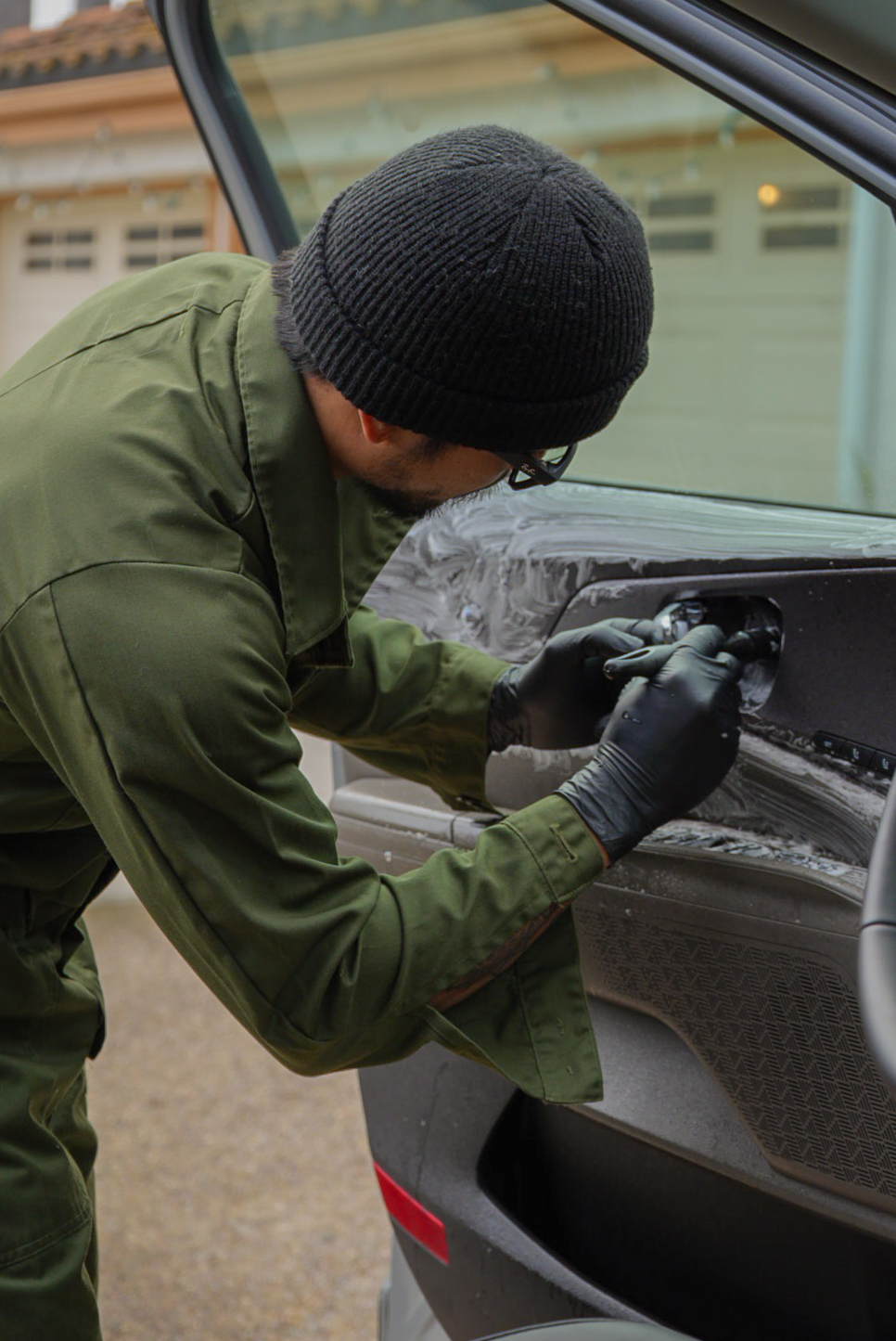 Gabriel detailing a vehicle by hand